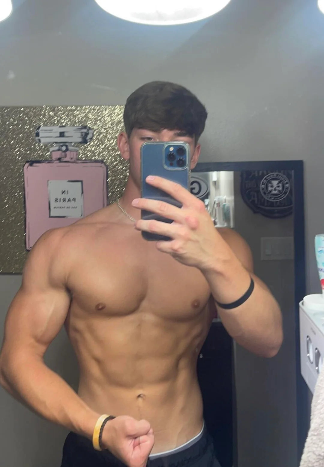 Shreded Guy taking a mirror selfie